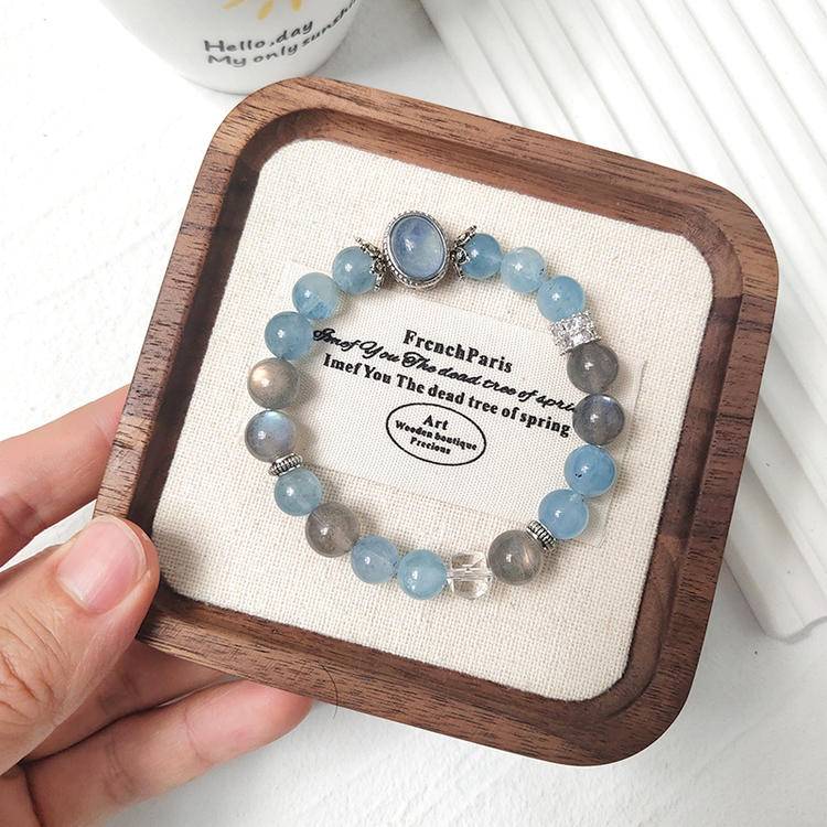 Aquamarine and moonstone bracelet promoting healing, intuition, and positive energy.
