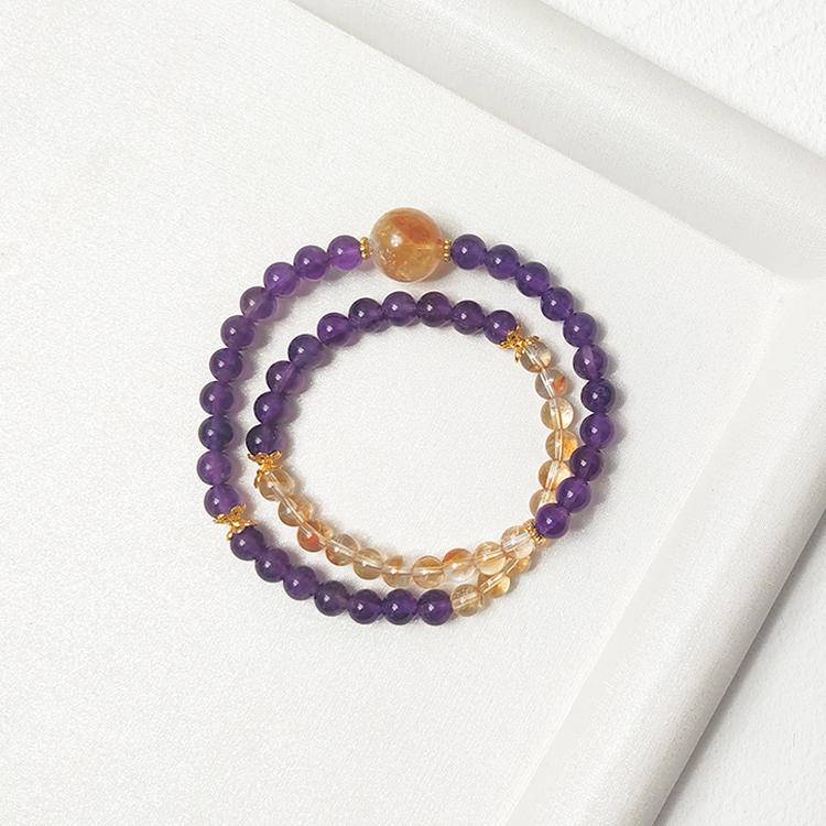 Amethyst and citrine double-strand bracelet supporting emotional balance, positive energy, and healing.
