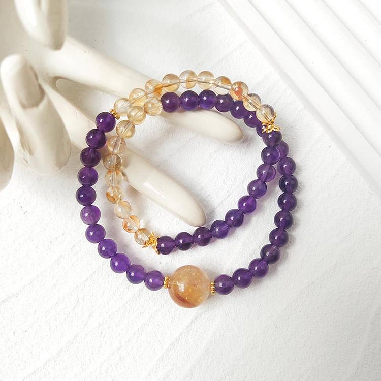 Healing bracelet featuring amethyst and citrine in a double-strand design for energy, balance, and emotional well-being.
