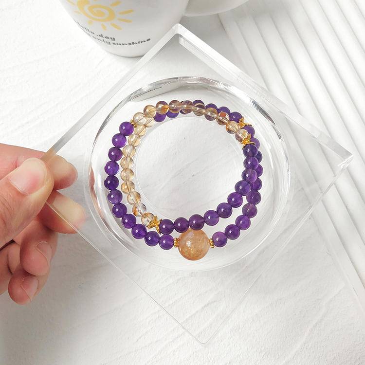 Amethyst and citrine double-strand multi-gemstone bracelet designed to promote healing, balance, and positive energy.
