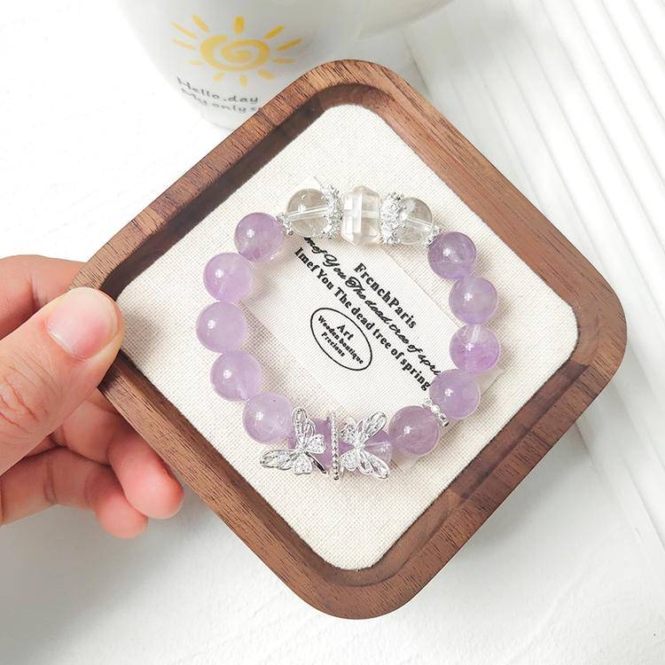 Multi-gem bracelet with amethyst and clear quartz butterfly, designed to enhance healing, balance, and positive energy.
