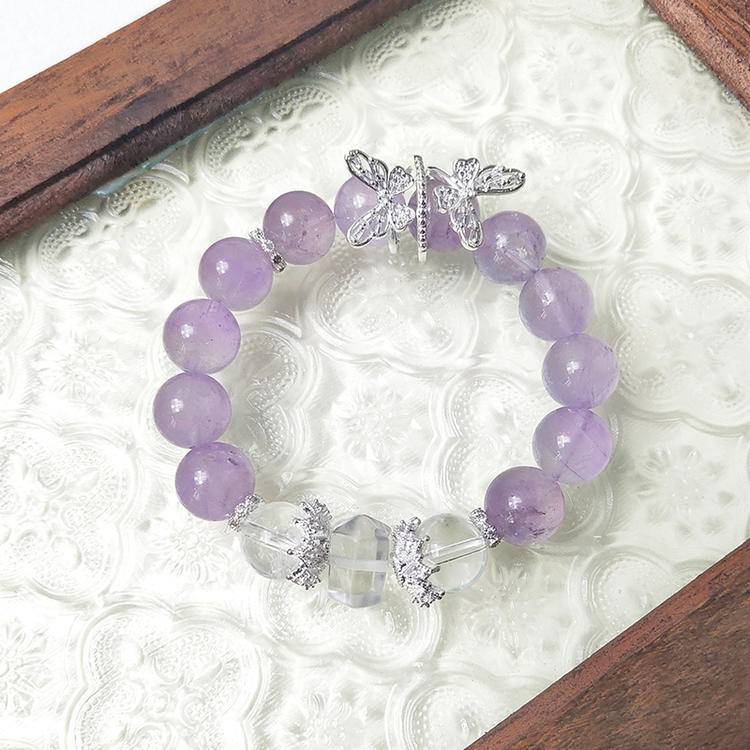 Amethyst and clear quartz butterfly multi-gemstone bracelet promoting healing, balance, and positive energy.
