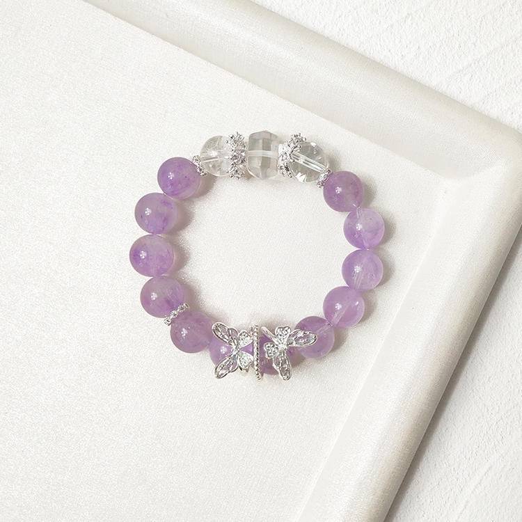 Amethyst and clear quartz butterfly multi-gemstone bracelet designed to promote healing, balance, and positive energy.
