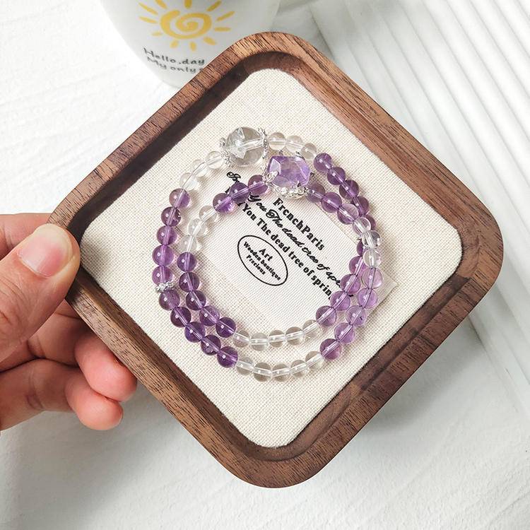 Double-strand multi-gem bracelet with amethyst and clear quartz, designed to enhance healing, balance, and positive energy.
