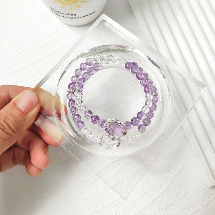 Healing bracelet featuring amethyst and clear quartz in a double-strand design for energy, balance, and emotional well-being.
