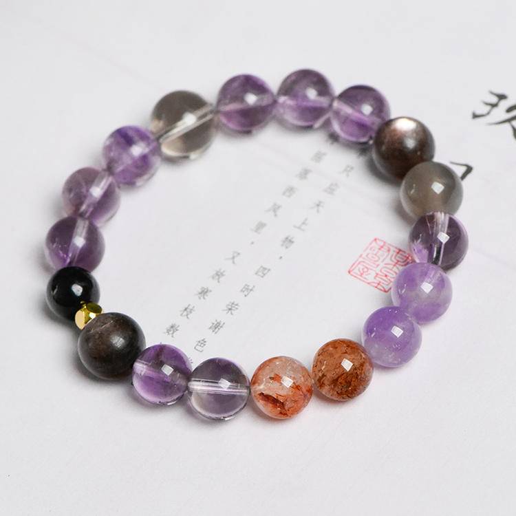 Multi-gem bracelet with amethyst and obsidian, designed to enhance healing, balance, and positive energy.
