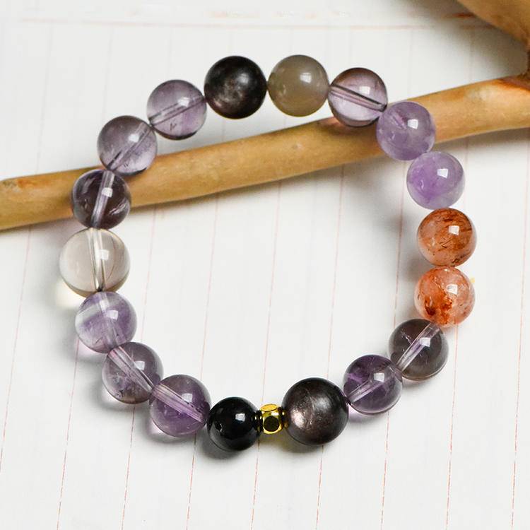 Amethyst and obsidian five-elements bracelet supporting emotional balance, positive energy, and healing.
