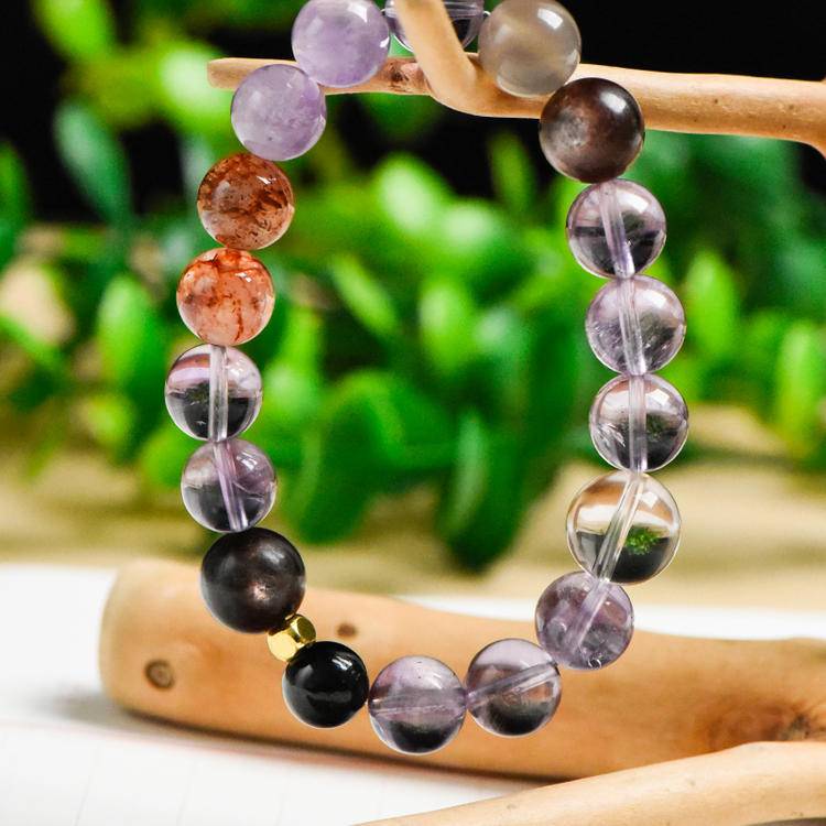 Amethyst and obsidian five-elements bracelet promoting healing, balance, and positive energy.
