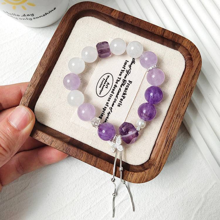 Amethyst and white phantom butterfly multi-gemstone bracelet promoting healing, balance, and positive energy.
