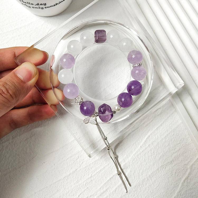 Multi-gem bracelet with amethyst and white phantom butterfly, designed to enhance healing, balance, and positive energy.
