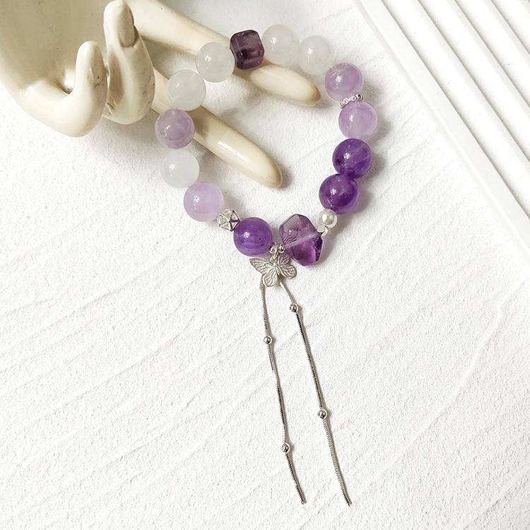 Amethyst and white phantom butterfly bracelet supporting emotional balance, positive energy, and healing.
