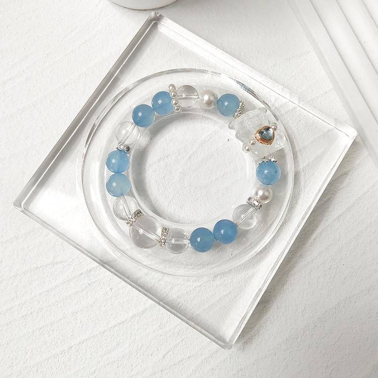 Aquamarine and bear charm multi-gemstone bracelet designed to promote healing, balance, and positive energy.