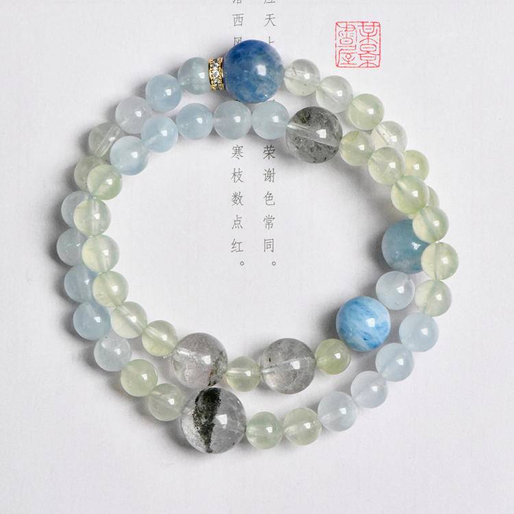 Multi-gem bracelet with aquamarine and green phantom quartz designed to enhance healing, clarity, and positive energy.