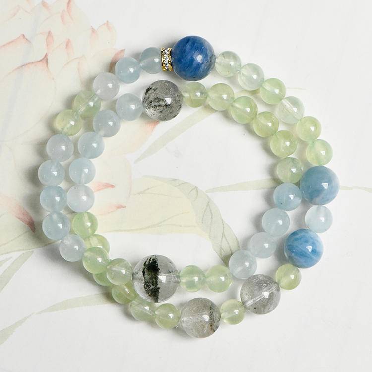 Aquamarine and green phantom quartz bracelet promoting energy, balance, and positive intentions.