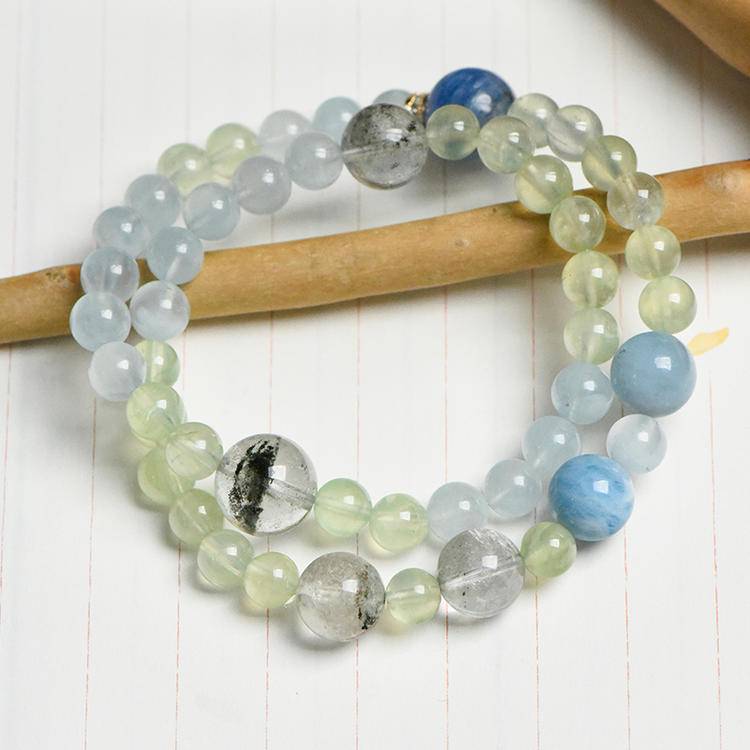 Healing multi-gem bracelet featuring aquamarine and green phantom quartz for emotional well-being and focus.