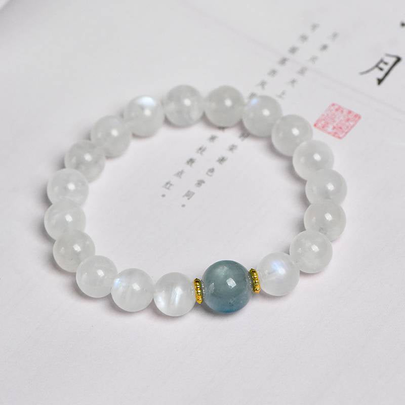Aquamarine and moonstone bracelet promoting intuition, calm, and positive energy.