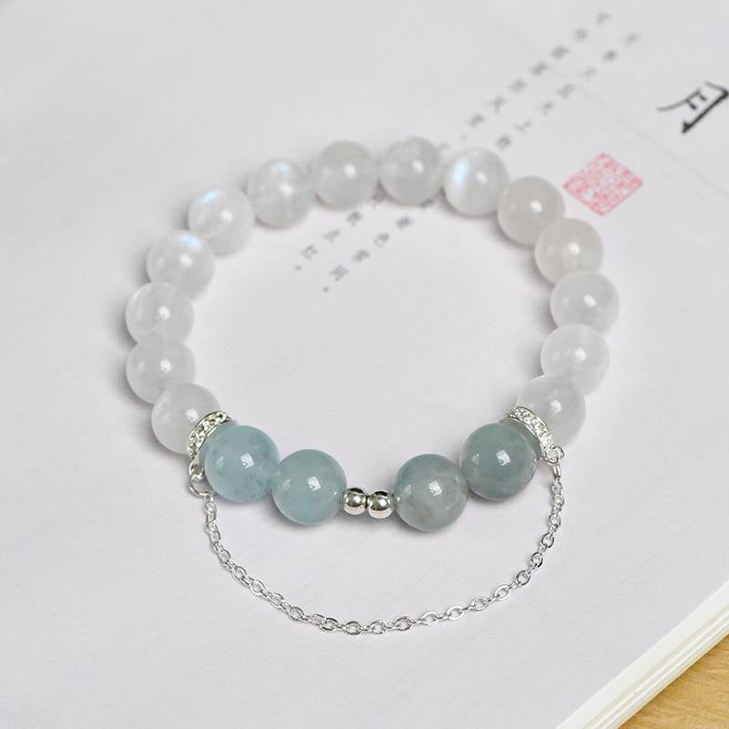 Aquamarine and moonstone bracelet promoting intuition, calm, and positive energy.