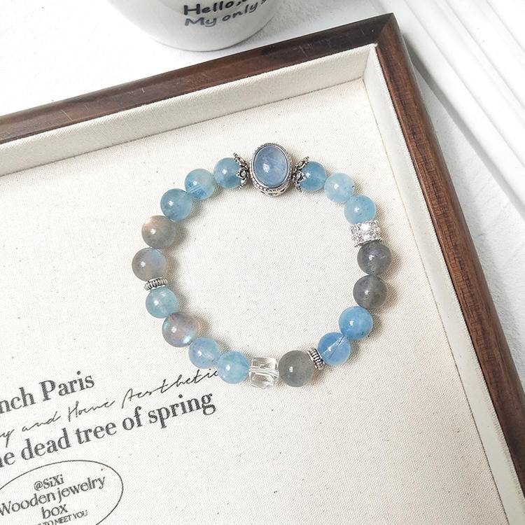 Aquamarine and moonstone multi-gemstone bracelet designed to promote healing, balance, and positive energy.