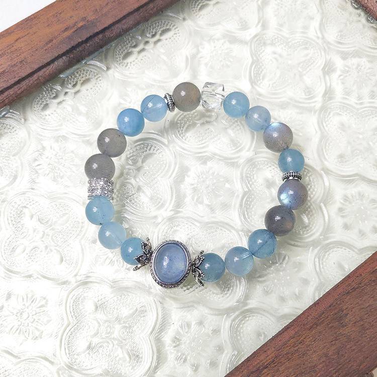 Healing multi-gem bracelet featuring aquamarine and moonstone for emotional balance and clarity.