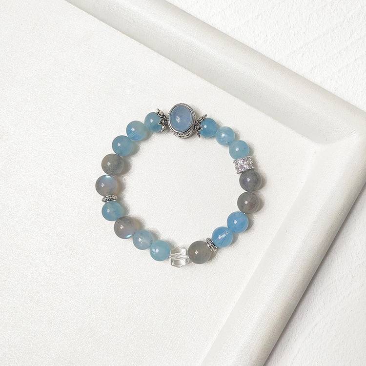 Multi-gem bracelet with aquamarine and moonstone designed to enhance intuition, energy, and healing.