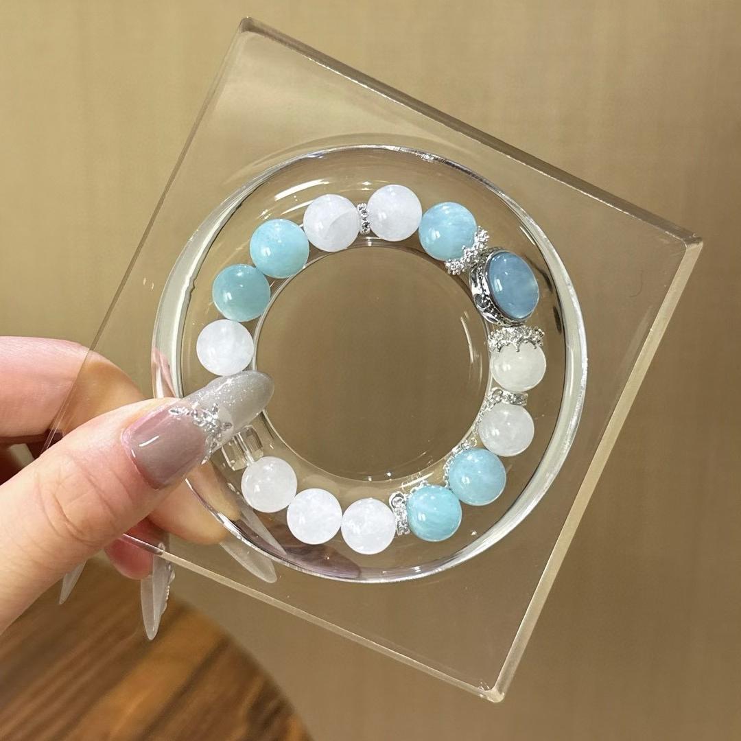 Aquamarine and white ghost quartz bracelet supporting emotional well-being and positive intentions.