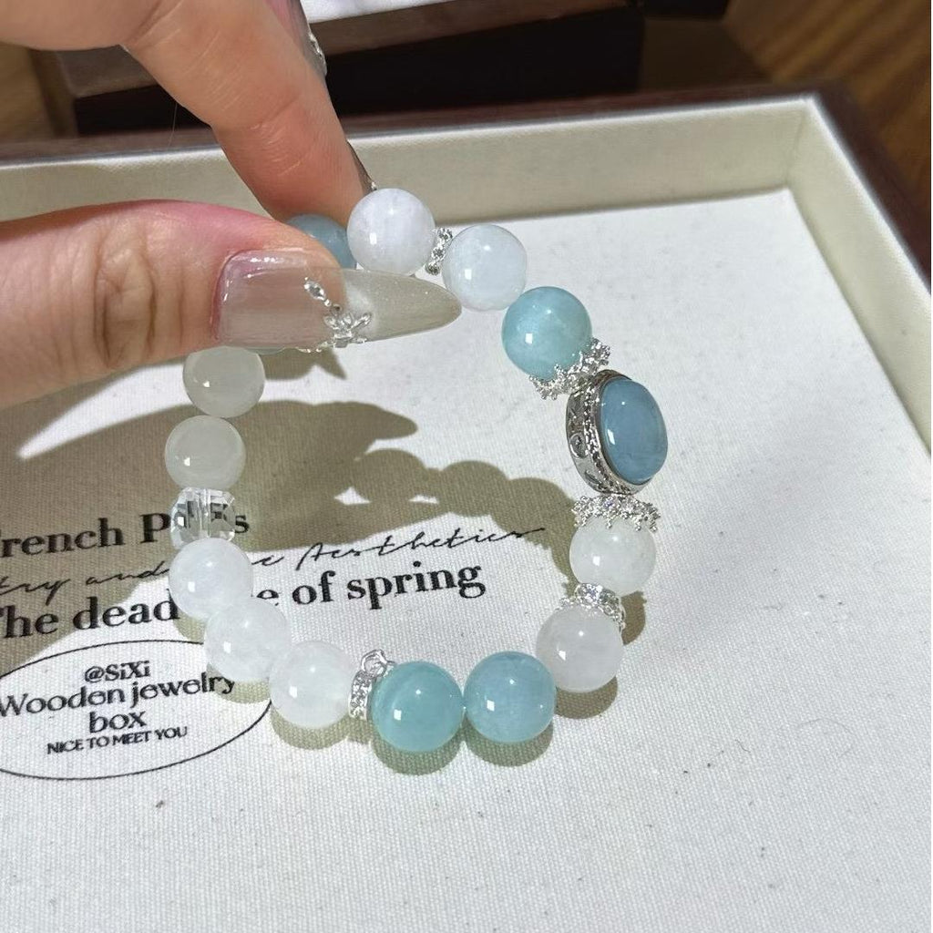 Healing multi-gem bracelet featuring aquamarine and white ghost quartz for emotional balance and focus.