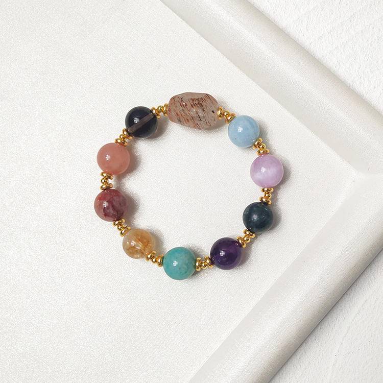 Multi-gemstone bracelet with black gold quartz, amethyst, sunstone, aquamarine, lepidolite, citrine, and red jade flower, enhancing positive energy and balance.