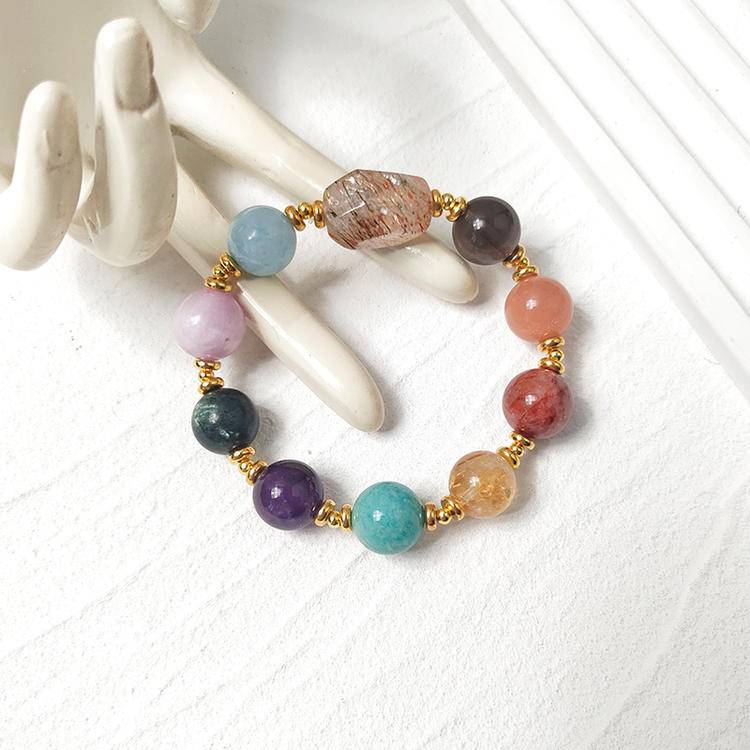 Black gold multi-gemstone bracelet with smoky quartz, citrine, amethyst, aquamarine, sunstone, lepidolite, and red jade flower for healing, energy, and emotional balance.
