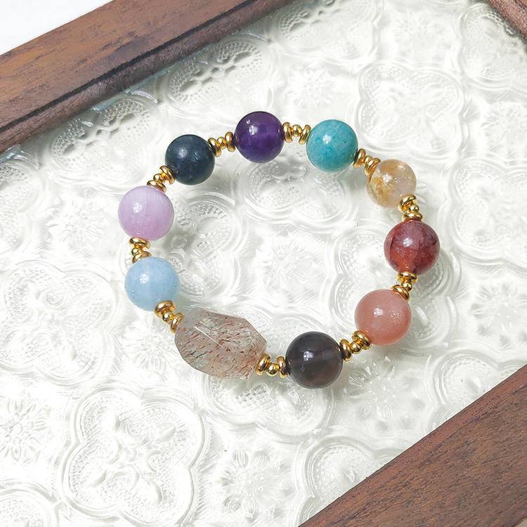 Black gold multi-gemstone bracelet with smoky quartz, amethyst, sunstone, aquamarine, lepidolite, citrine, and red jade flower, promoting healing, positive energy, and emotional balance.