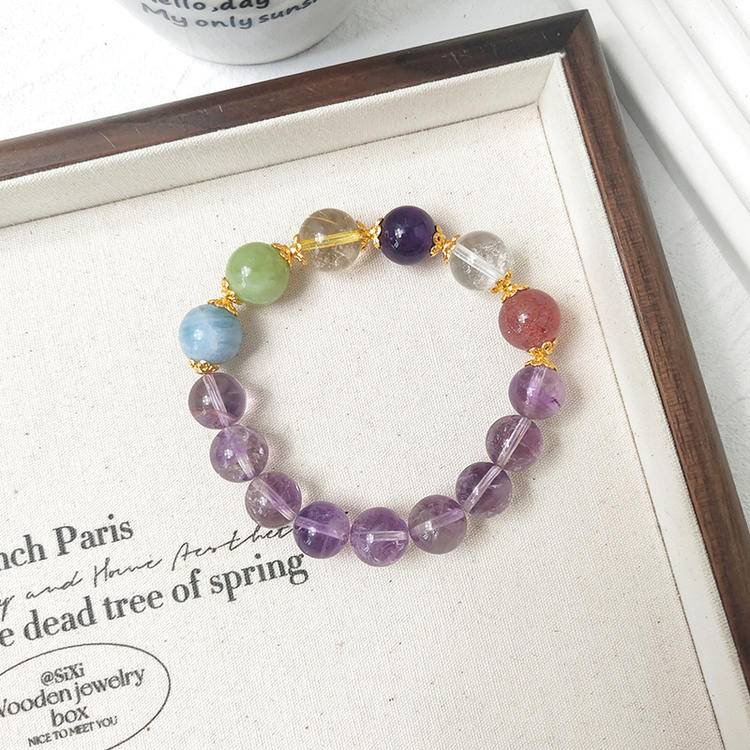 Brazilian amethyst, clear quartz, fluorite, and aquamarine multi-gemstone bracelet promoting healing, balance, and positive energy.
