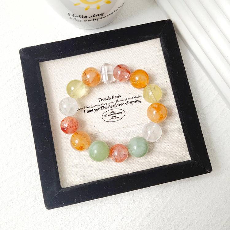 Multi-gem bracelet with citrine, agate, and Xiuyu jade designed to enhance abundance, balance, and positive energy.