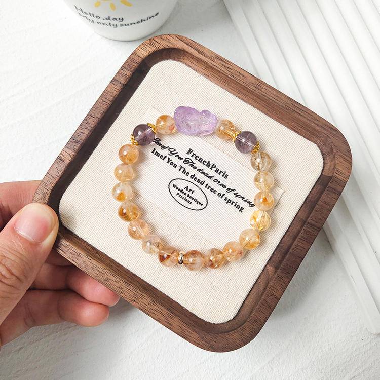Citrine and amethyst bracelet supporting emotional balance, protection, and healing energy.