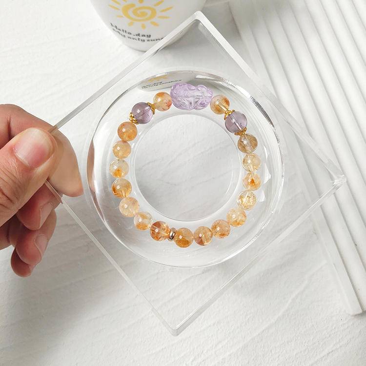 Citrine and amethyst multi-gemstone bracelet designed to promote protection, balance, and positive energy.