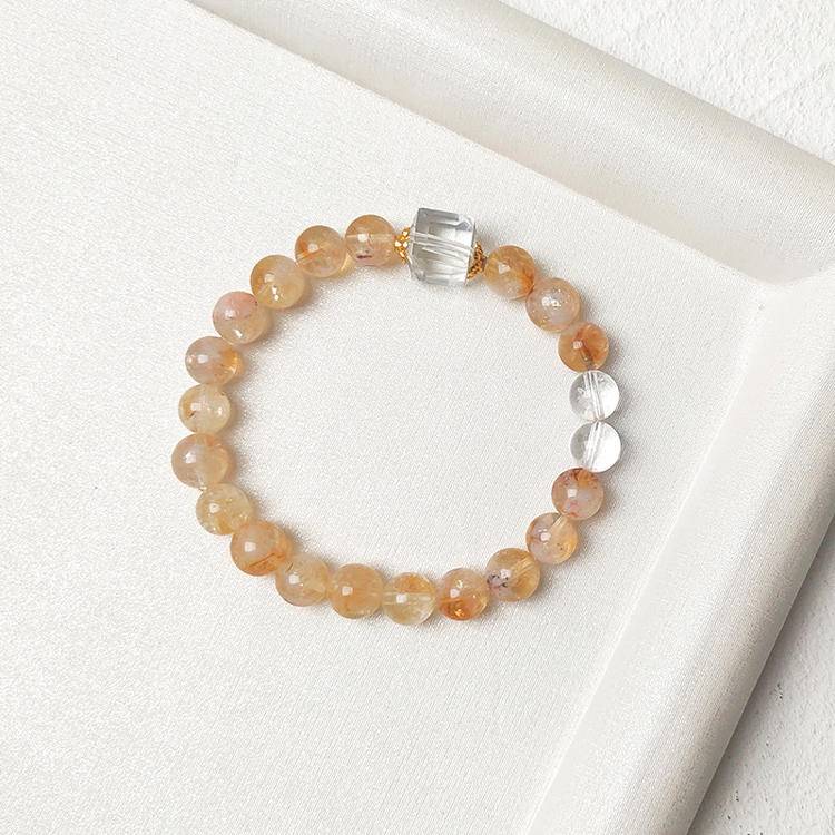 Healing multi-gem bracelet featuring citrine and clear quartz for emotional well-being and balance.