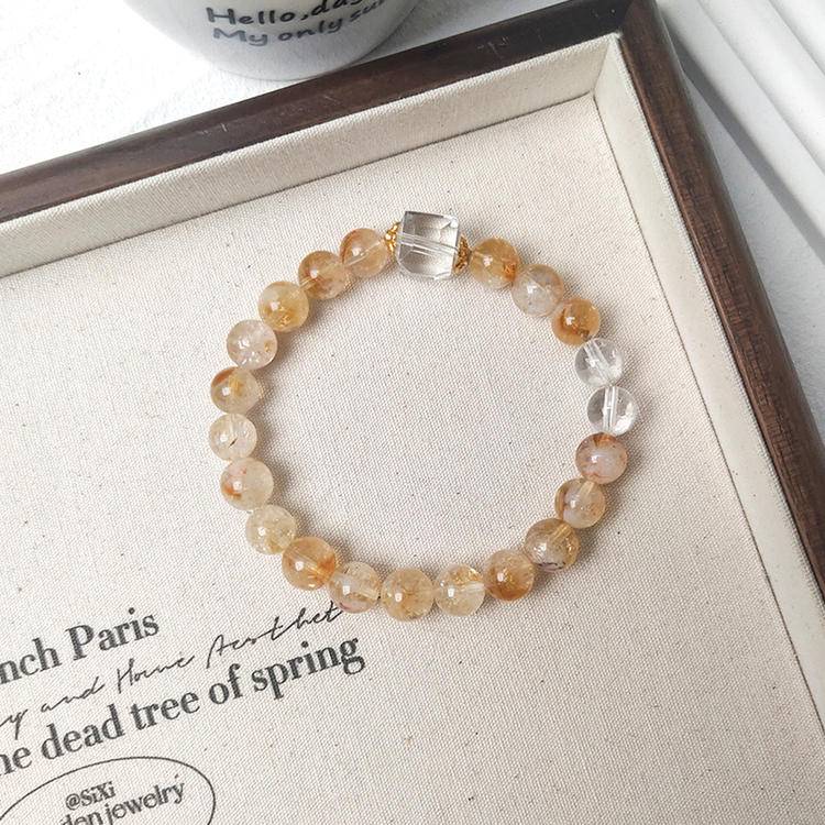 Citrine and clear quartz bracelet supporting emotional balance, energy, and positive intentions.