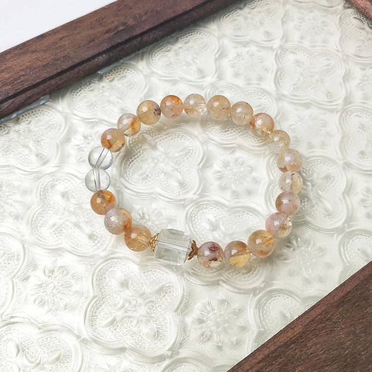 Citrine and clear quartz multi-gemstone bracelet designed to promote healing, balance, and positive energy.