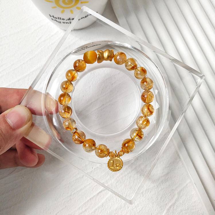 Citrine and lucky cat bracelet supporting prosperity, balance, and emotional well-being.