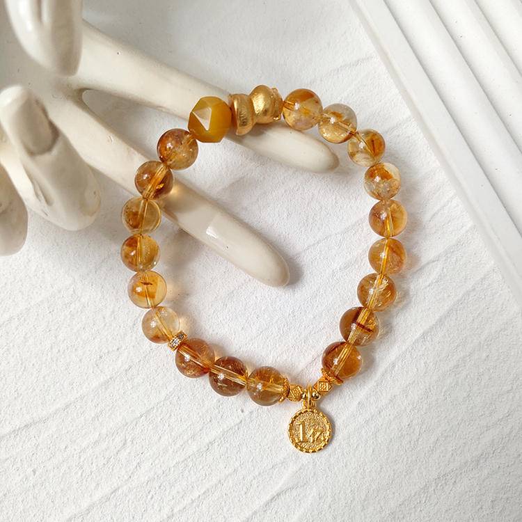 Citrine and lucky cat multi-gemstone bracelet designed to promote wealth, balance, and positive intentions.