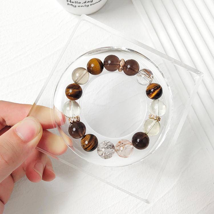 Healing bracelet featuring citrine, tiger eye, and smoky quartz for energy, clarity, and prosperity.