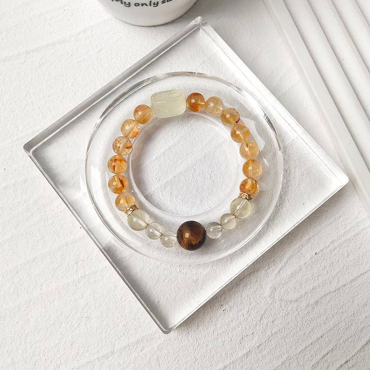 Healing bracelet featuring citrine, tiger eye, and Zaki Lhamo for energy, clarity, and prosperity.