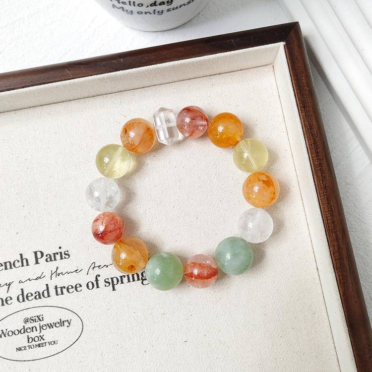 Citrine, yellow jade flower, fluorite, red jade flower, snow phantom quartz, and clear quartz multi-gemstone bracelet, promoting healing, balance, and positive energy.
