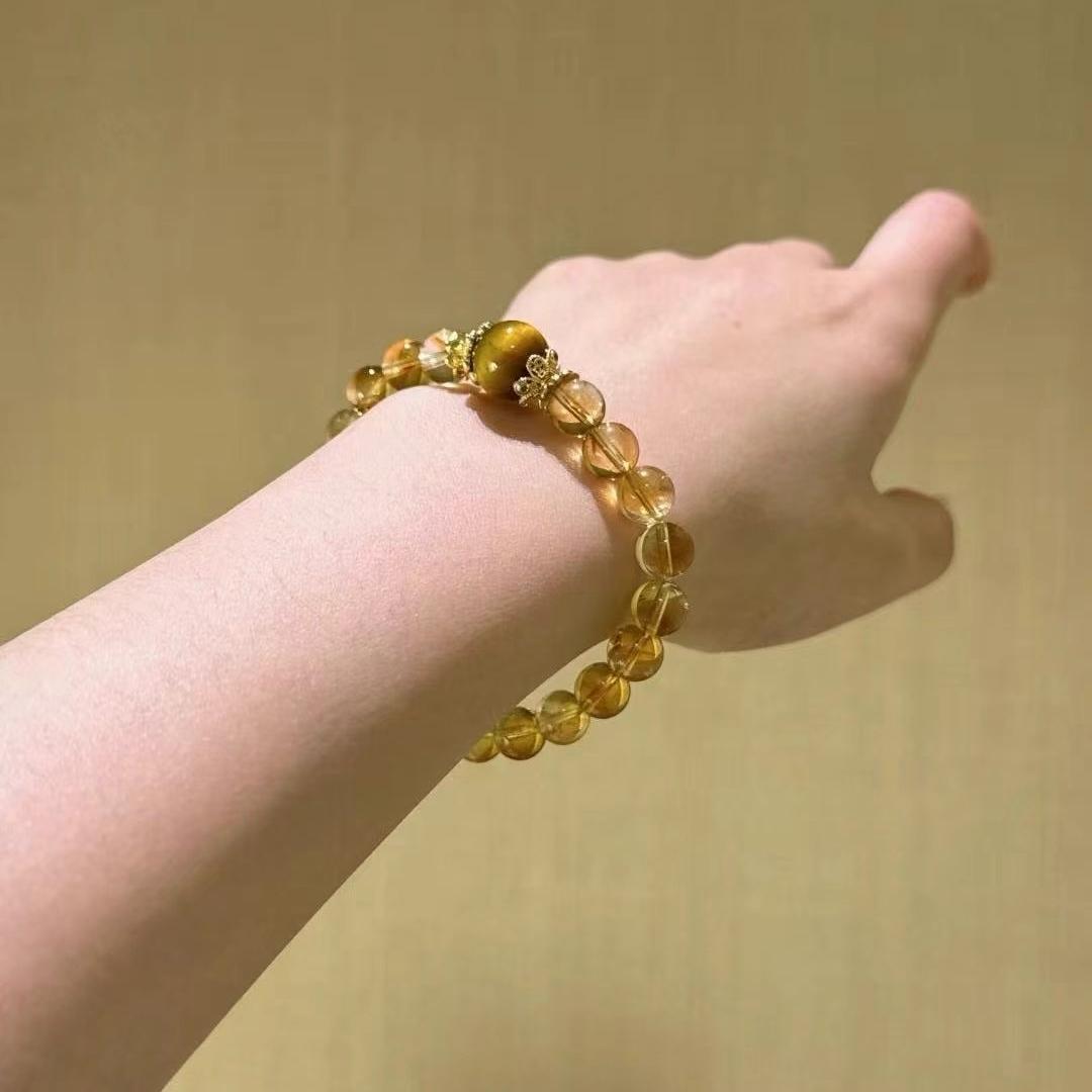 Citrine and yellow tiger's eye multi-gemstone bracelet designed to promote healing, balance, and positive energy.
