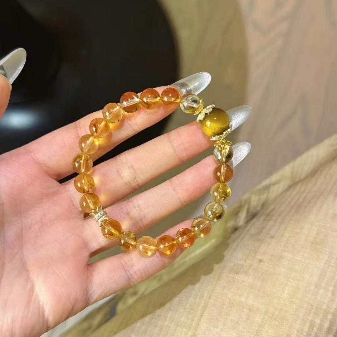 Multi-gem bracelet with citrine and yellow tiger's eye designed to enhance healing, focus, and positive energy.