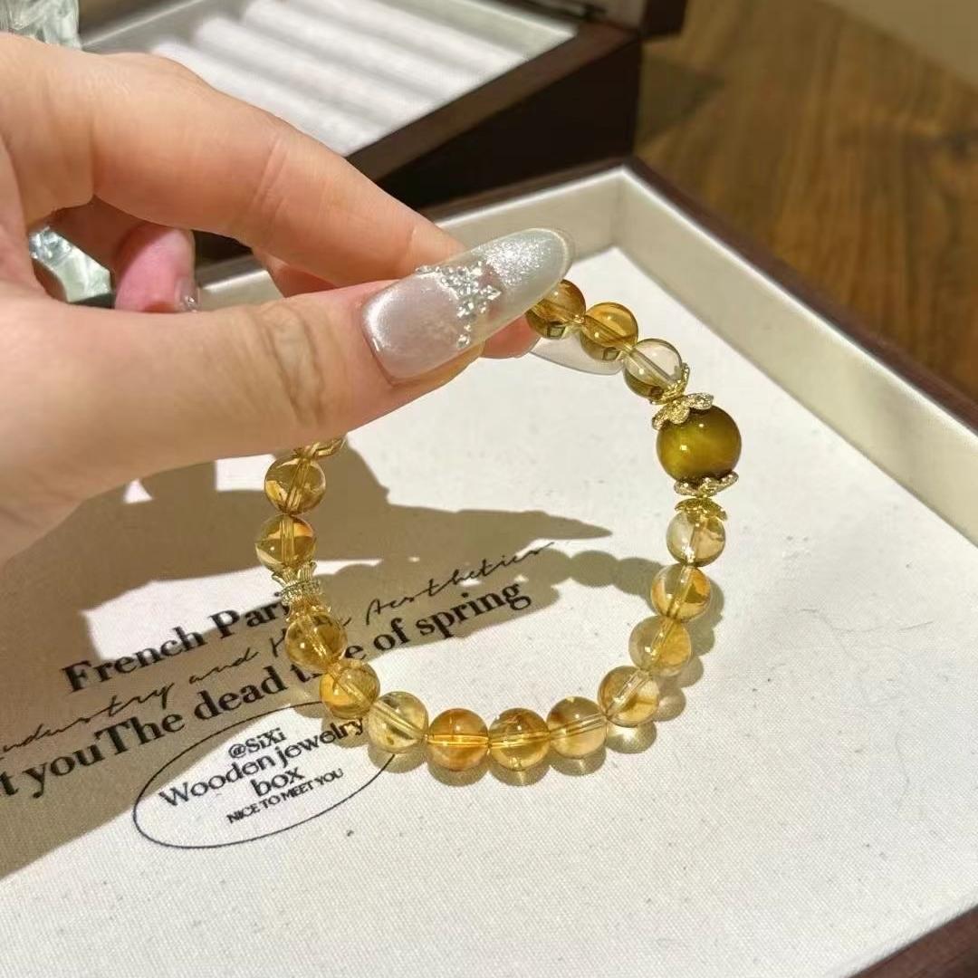 Healing multi-gem bracelet featuring citrine and yellow tiger's eye for emotional well-being and balance.