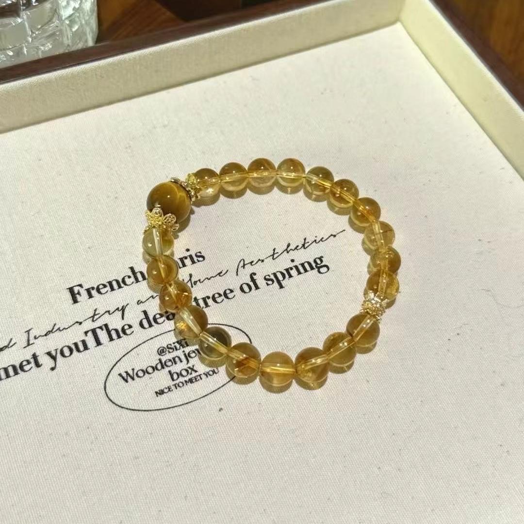 Citrine and yellow tiger's eye bracelet promoting healing, energy, and positive intentions.