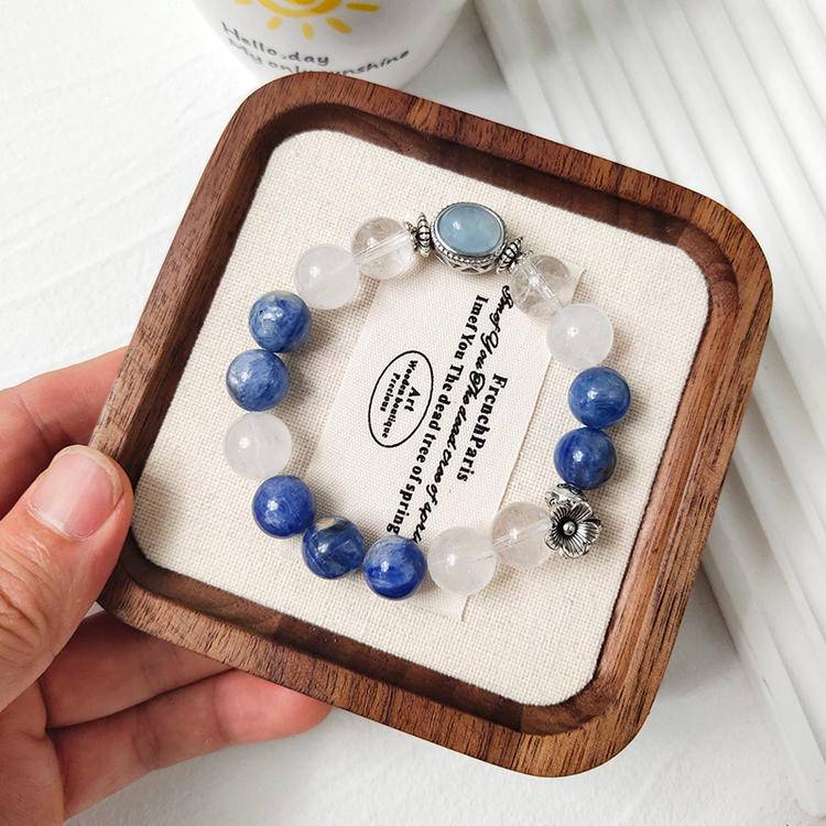 Clear quartz, blue crystal, and aquamarine multi-gemstone bracelet with alloy magic box design, promoting healing, emotional balance, and positive energy.
