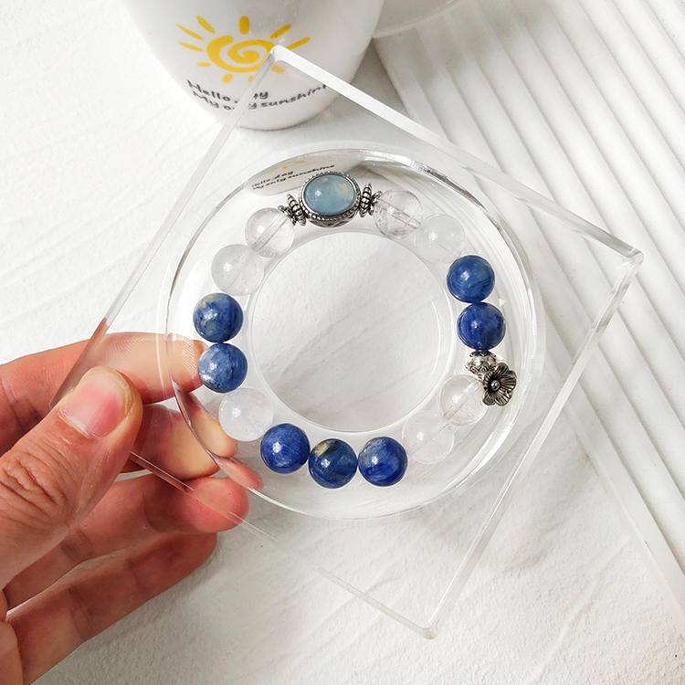 Clear quartz, blue crystal, and aquamarine bracelet with alloy magic box, promoting emotional balance, healing, and positive energy.
