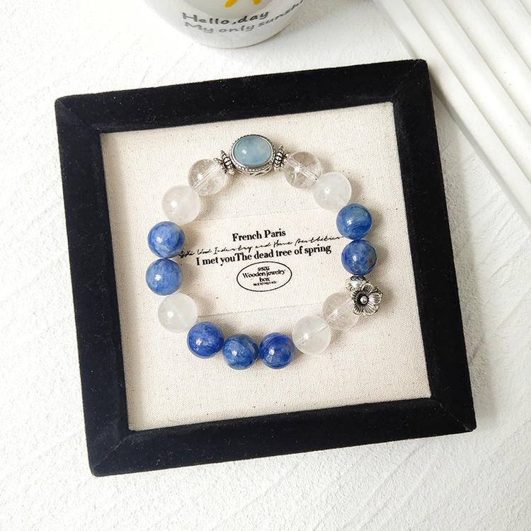 Healing bracelet featuring clear quartz, blue crystal, and aquamarine in alloy magic box design for emotional well-being, energy, and balance.
