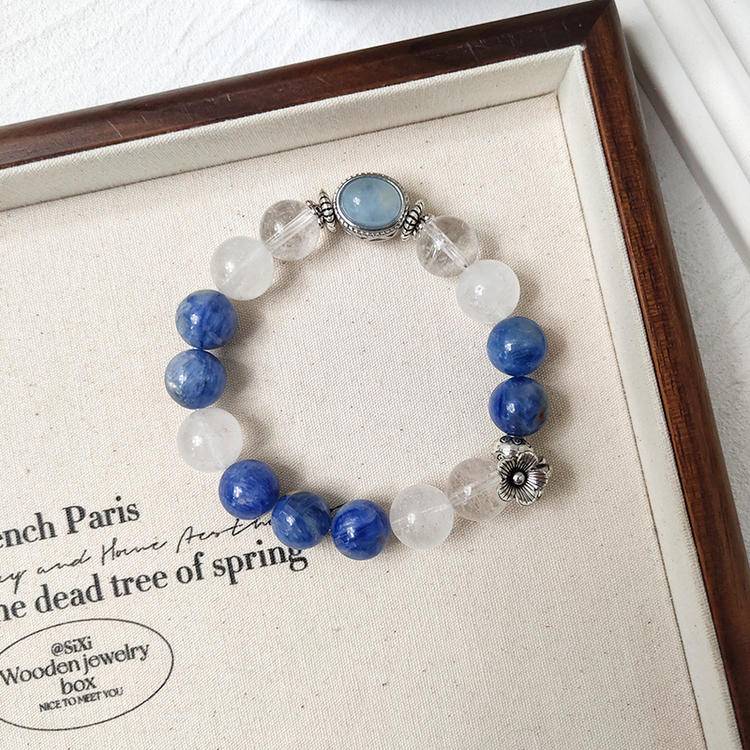 Healing multi-gemstone bracelet featuring clear quartz, blue crystal, aquamarine, and alloy magic box for energy balance, emotional well-being, and positive vibes.
