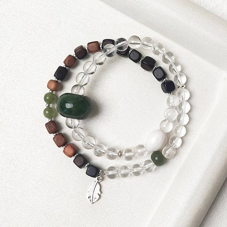 Double wrap bracelet with clear quartz, jade, and agarwood, designed to enhance healing, balance, and positive energy.
